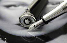 Load image into Gallery viewer, Close up to the fountain pen nib and the top of the cap.

