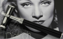 Load image into Gallery viewer, The fountain pen with the nib resting on the cap.
