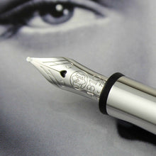 Load image into Gallery viewer, Close up to the nib with engraved decorations, Montblanc logo, 810 logo, and 18K 750 gold hallmarks.
