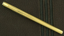 Load image into Gallery viewer, The golden fountain pen with the cap on.
