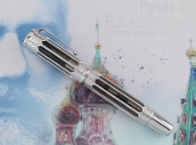 Load image into Gallery viewer, Side view of the fountain pen with the cap on. Set on the card stock box.
