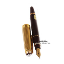 Load image into Gallery viewer, Angled view of the fountain pen and cap on a white background.
