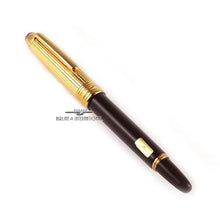 Load image into Gallery viewer, Angled view of the fountain pen with the cap on.
