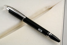 Load image into Gallery viewer, Angled front view of the pen with the cap on.
