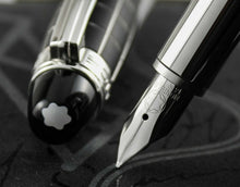 Load image into Gallery viewer, Close up to the fountain pen nib and the top of the cap.
