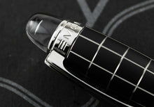 Load image into Gallery viewer, Close up to the top of the cap with the model number and text engravings. 
