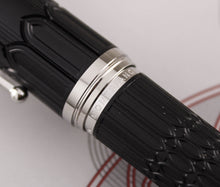 Load image into Gallery viewer, Close up to the word MONTBLANC engraved on the silver rings of the pen.
