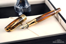 Load image into Gallery viewer, The fountain pen with the cap next it. Set in the presentation box.
