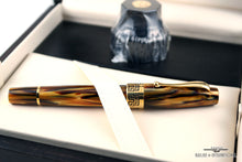 Load image into Gallery viewer, Side view of the fountain pen in the presentation box.
