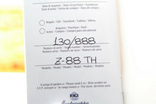 Load image into Gallery viewer, Interior view of the booklet, featuring the edition and model number.

