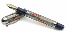 Load image into Gallery viewer, The fountain pen resting on the cap.
