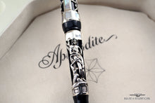Load image into Gallery viewer, Close up to the silver overlay on the fountain pen body.
