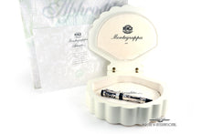Load image into Gallery viewer, The fountain pen arranged with the shell-shaped presentation box, certificate, and outer box.

