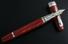 Load image into Gallery viewer, The fountain pen nib resting on the cap.
