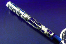 Load image into Gallery viewer, Angled front view of the fountain pen with the cap on.

