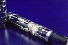 Load image into Gallery viewer, Close up to the golden overlay skeleton on the pen body.
