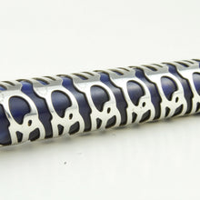 Load image into Gallery viewer, Close up to the silver skeleton overlay on the pen. 
