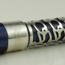 Load image into Gallery viewer, Angled close up to the cap band with engraved decorations.
