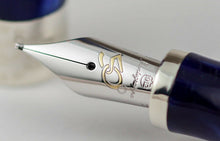 Load image into Gallery viewer, Close up to the fountain pen nib with engraved Montegrappa logo, and European Community 50 Anniversary logo.
