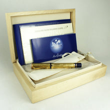 Load image into Gallery viewer, The gold fountain pen arrange din the wooden presentation box with the booklets, sleeves, and polishing cloth.
