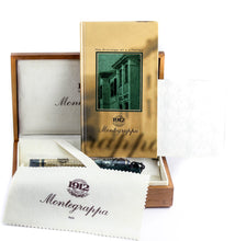 Load image into Gallery viewer, The fountain pen arranged in the wooden presentation box with the plastic sleeve, fabric sleeve, booklet, and polishing cloth.
