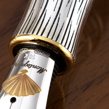 Load image into Gallery viewer, Close up to the fountain pen nib hallmarks, star symbol, 2670V, 750, 18K
