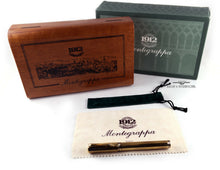 Load image into Gallery viewer, The fountain pen arranged with the outer green cardstock box, wooden box, polishing cloth, and green pen sleeve.
