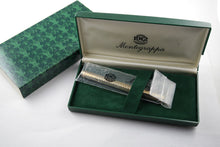 Load image into Gallery viewer, The fountain pen arranged in the original Montegrappa plastic sleeve, presentation box, and green card stock box.
