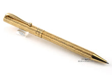 Load image into Gallery viewer, Angled vie of the golden ballpoint pen.
