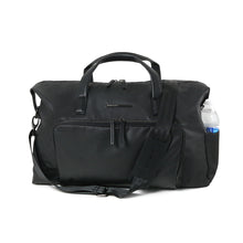 Load image into Gallery viewer, Front view of the black duffle bag with a water bottle fitted on the side panel pocket.
