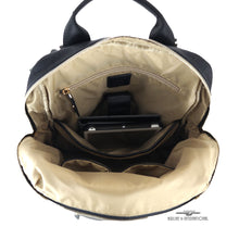Load image into Gallery viewer, Interior view of the backpack with a tablet tucked in the laptop compartment. 
