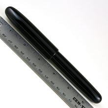 Load image into Gallery viewer, Back view of the fountain pen placed next to a ruler. It measures a little over six and a half inches. 
