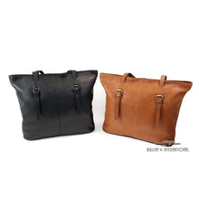 Load image into Gallery viewer, The tan and black leather tote bags on a white background. 
