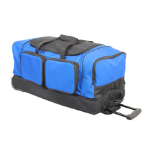 Load image into Gallery viewer, Angled view of the black and blue wheeled duffle with the telescopic handle extended. 
