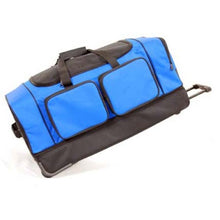 Load image into Gallery viewer, Side panel view of the black and blue duffle bag with the telescopic handle extended.
