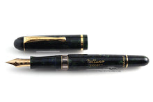 Load image into Gallery viewer, Front view of the green fountain pen with the cap next to it.
