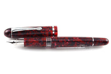 Load image into Gallery viewer, Front view of the burgundy fountain pen with the cap next to it.
