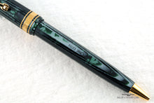 Load image into Gallery viewer, Close up to the OMAS EXTRA engraving on the pen body.

