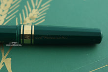 Load image into Gallery viewer, Close up to the engravings on the pen cap.
