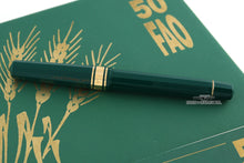 Load image into Gallery viewer, Back view of the green fountain pen with the cap on.
