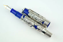 Load image into Gallery viewer, Front view of the fountain pen with the cap next to it. 

