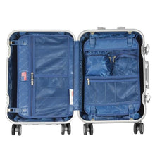 Load image into Gallery viewer, Interior view of the silver colored suitcase with blue interior lining. It features panel dividers with zipper closing compartments.

