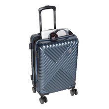 Load image into Gallery viewer, Angled view of the navy blue suitcase with a laptop and headphones peeking from the top zipper.
