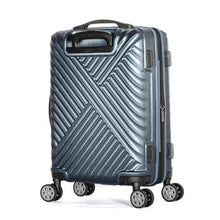 Load image into Gallery viewer, Angled back panel view of the navy blue suitcase with ridged design.
