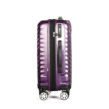 Load image into Gallery viewer, Side panel view of the purple hard shell suitcase. It features a three-digit combination TSA lock, and a grip handle. 
