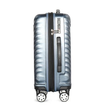 Load image into Gallery viewer, Side panel view of the navy blue suitcase. It features a three-digit combination TSA lock, and a grip handle. 
