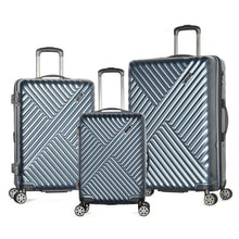 Load image into Gallery viewer, The navy blue carry-on, medium, and large suitcases arranged on a white background. 
