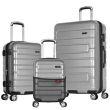 Load image into Gallery viewer, The silver carry-on, medium, and large suitcases arranged on a white background.
