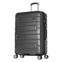 Load image into Gallery viewer, Angled front view of the black hard shell suitcase on a white background. 
