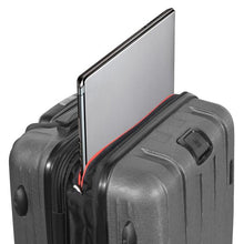 Load image into Gallery viewer, Angled top view of the charcoal gray suitcase with a laptop peeking from the top compartment.
